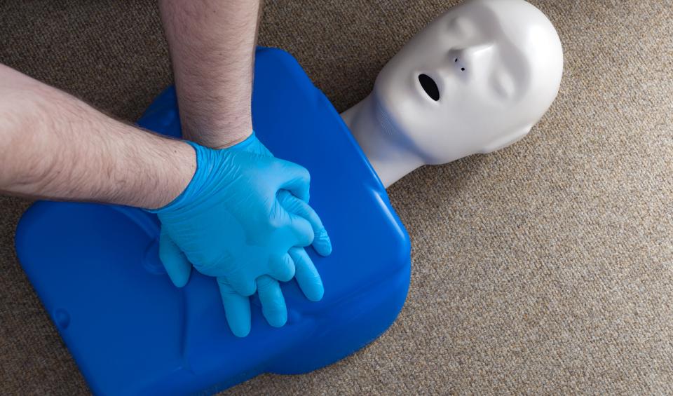 CPR dummy on floor for training
