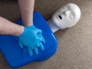 CPR dummy on floor for training